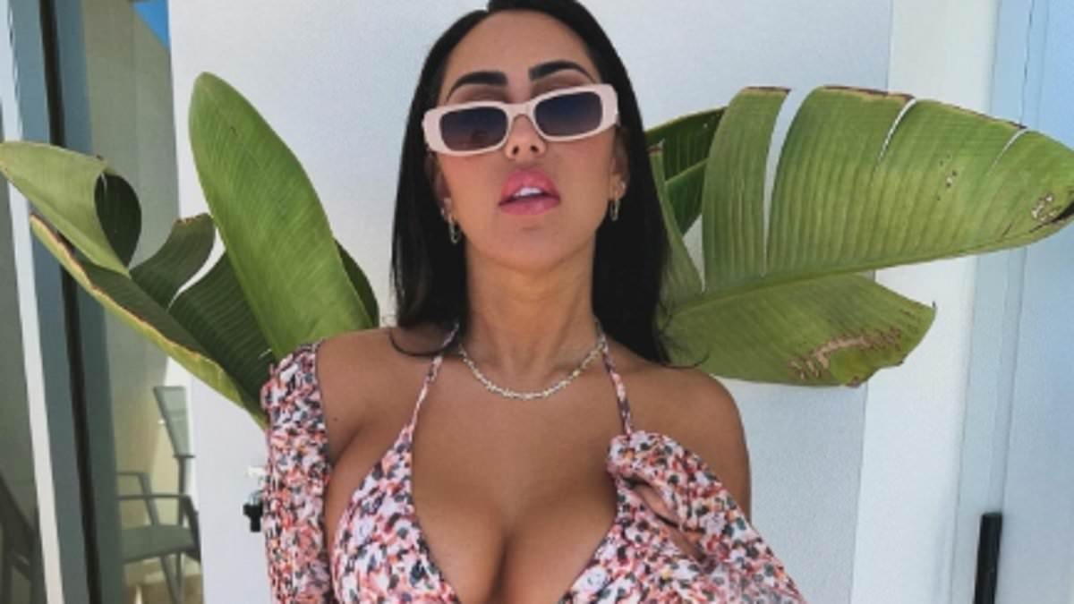 Sophie Kasaei puts on a VERY busty display in a skimpy multi-coloured bikini as she poses on holiday in Gran Canaria - after revealing she 'almost died' due to a botched bum lift