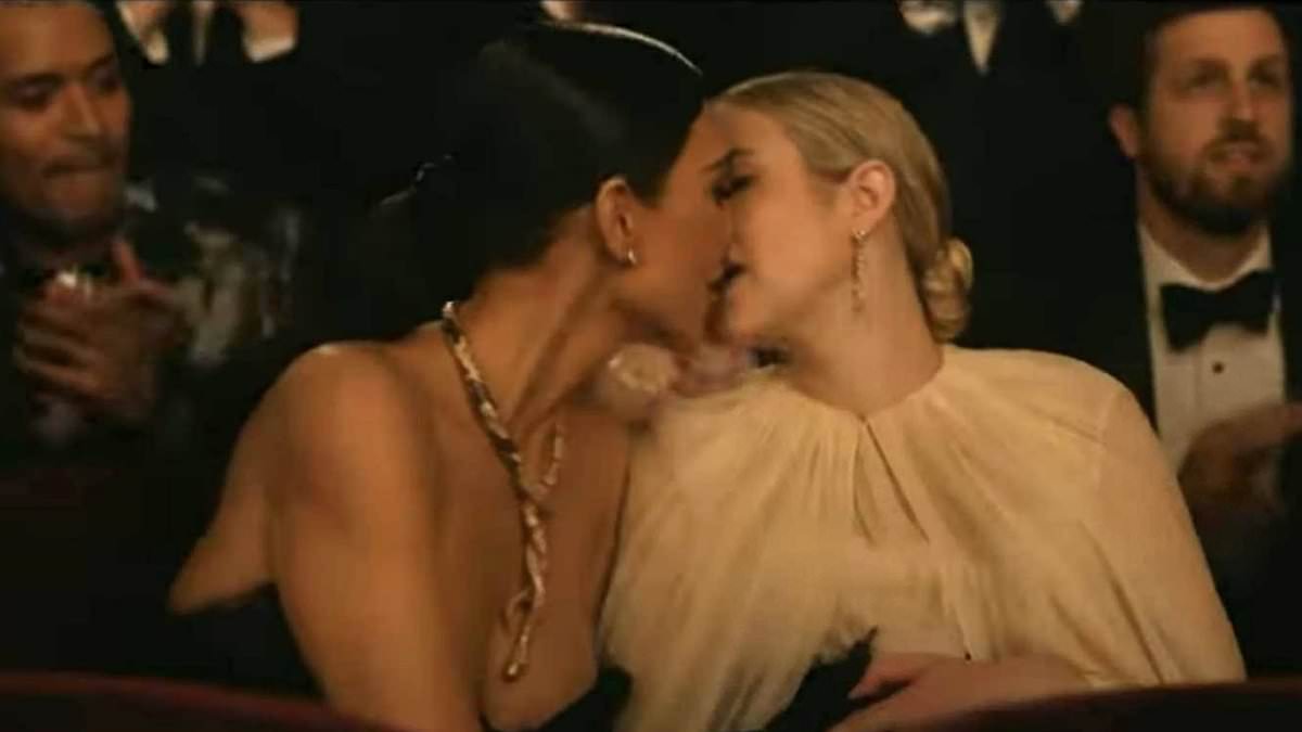 Kim Kardashian leans in for long victory kiss with Emma Roberts during steamy scene set at the Oscars on American Horror Story: Delicate