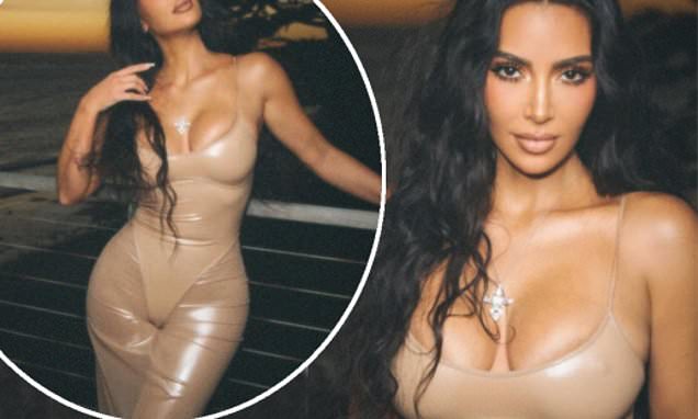 Kim Kardashian shows off her jaw-dropping figure in a VERY racy dress