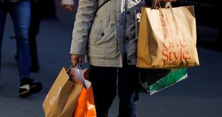 US consumer spending rises in November; monthly inflation subsides