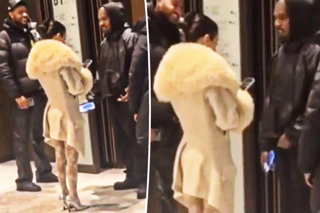 Bianca Censori covers up in furry white coat during outing with...