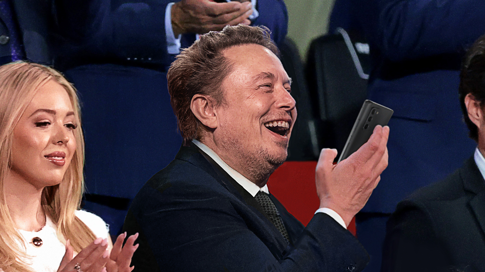 Elon Musk Holds Up AI Girlfriend App So She Can See