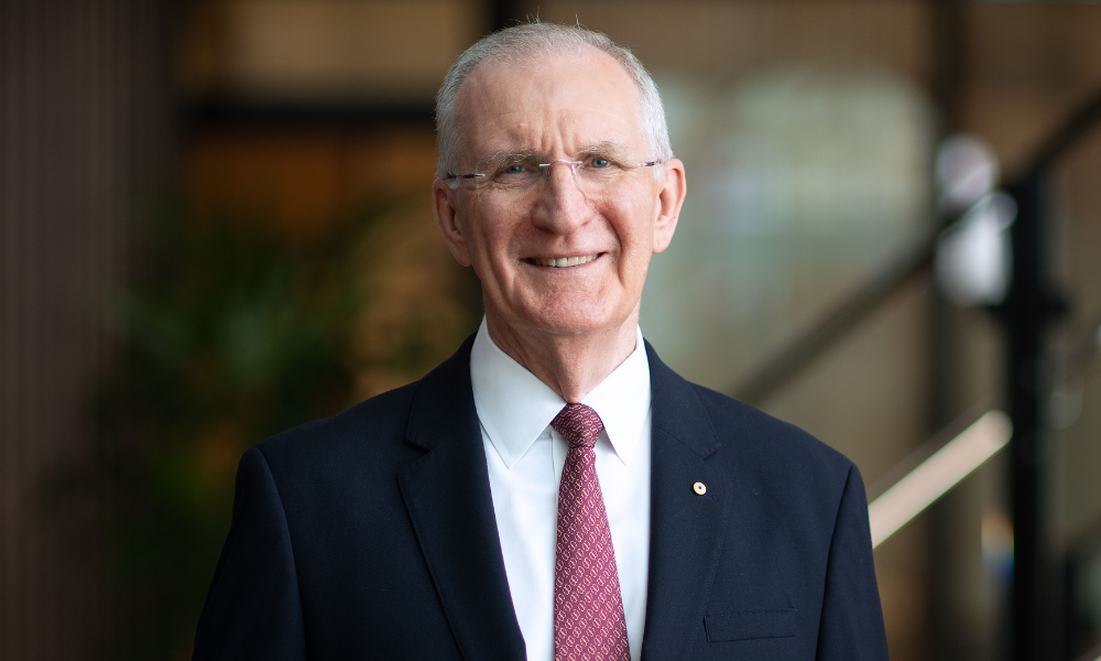 Insurance taxes too high, says QBE - announces disaster claims of $420 million