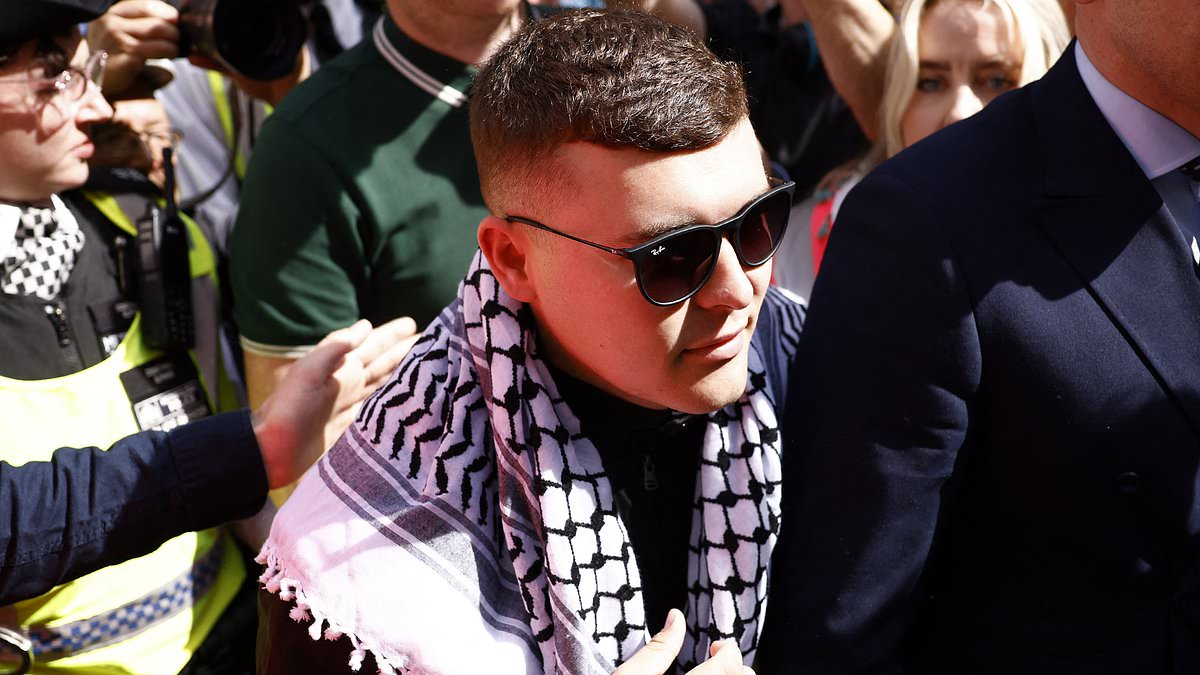 Hundreds of Kneecap fans descend on court to support rapper, 27, accused of displaying Hezbollah flag during gig