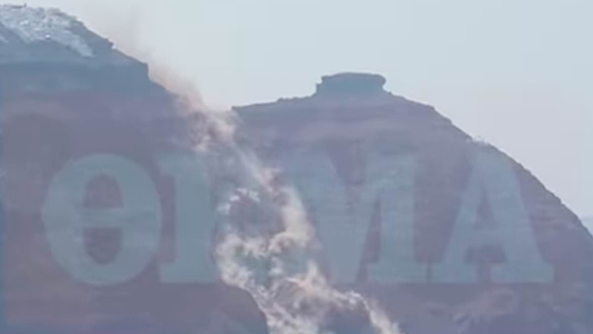 Moment massive landslide crashes into the sea in Santorini engulfing village with dust as tourists watch on - six months after holiday island was rattled by earthquakes