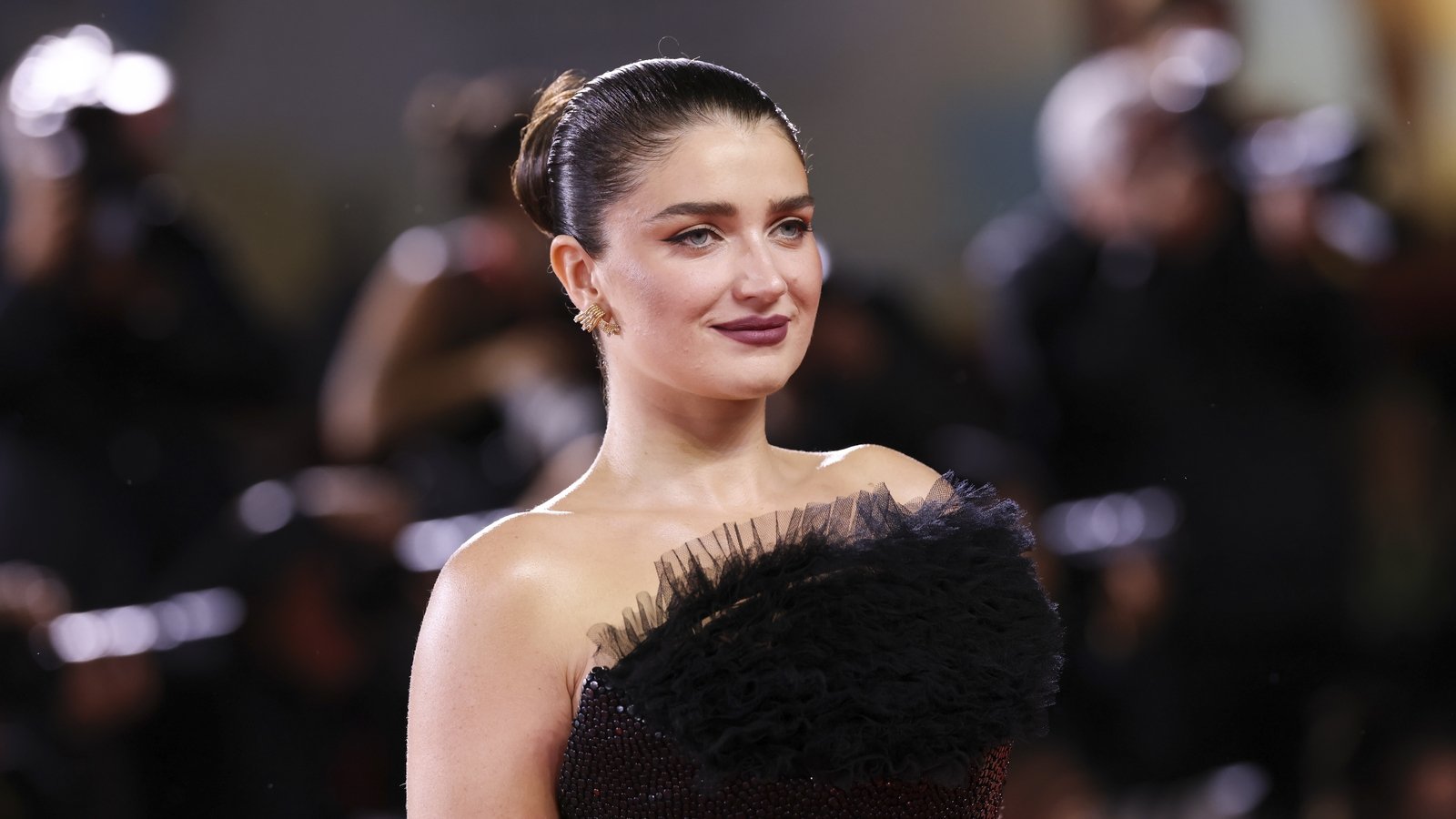 Eve Hewson channels vampy drama in black ballgown in Venice