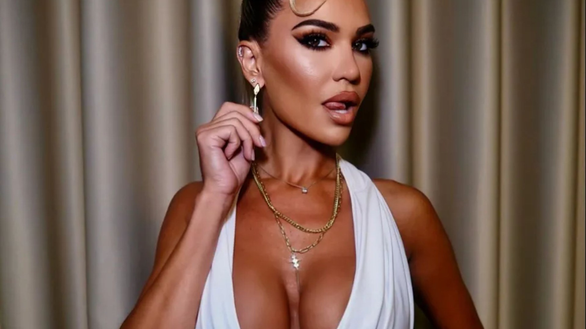 Christine McGuinness channels her inner Kim Kardashian in plunging white outfit