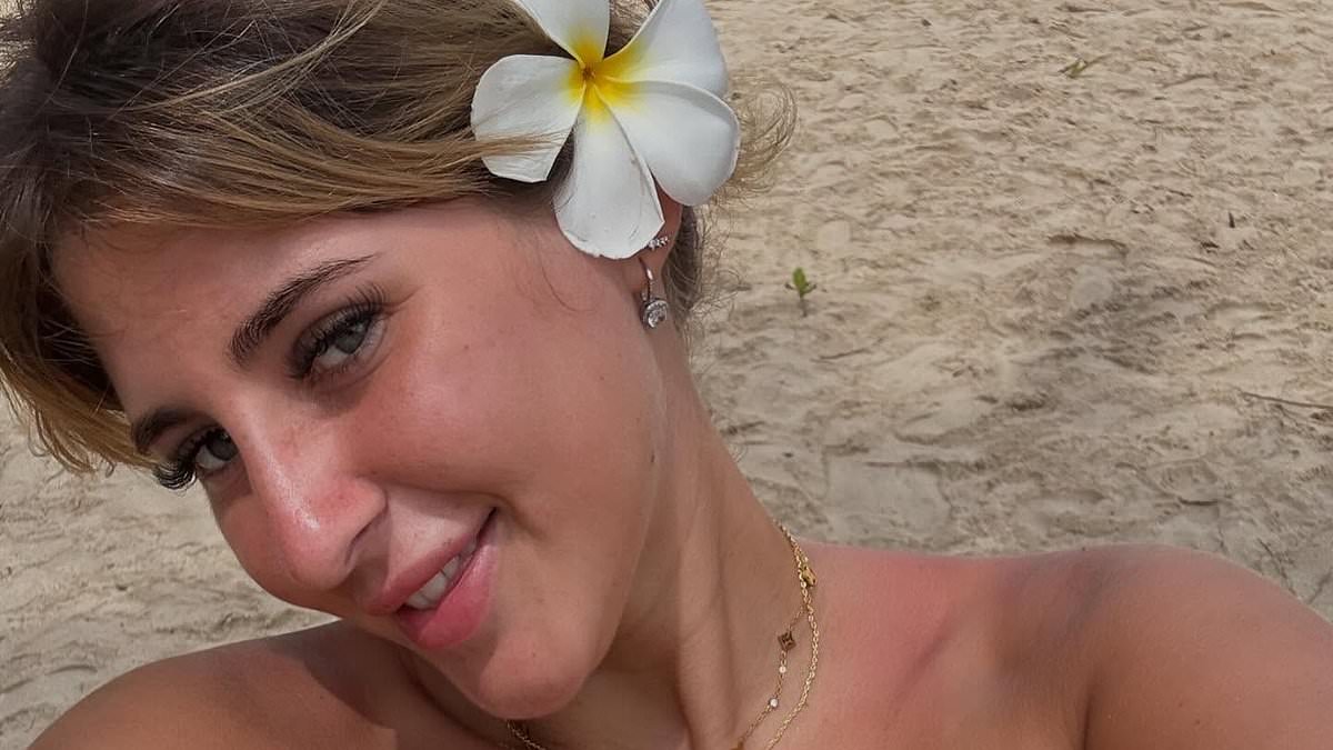 Bella Culley toasts bread over candle behind bars