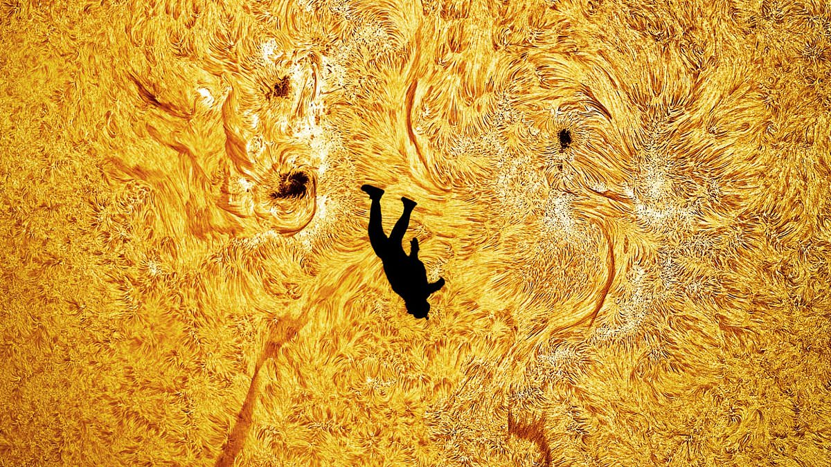 The Fall of Icarus: Photographer captures an 'absolutely preposterous' snap of a SKYDIVER appearing to fall from the sun