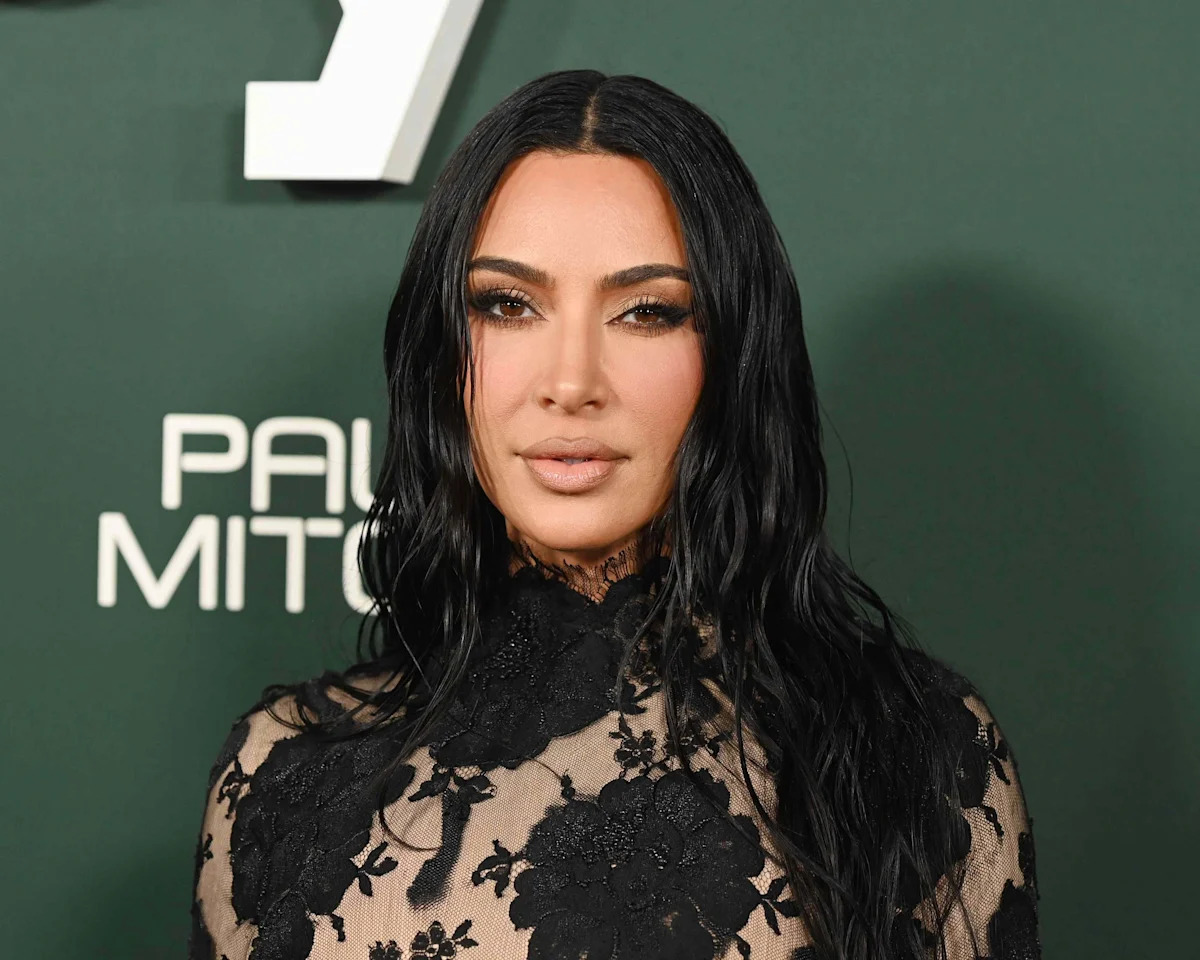 Kim Kardashian Shows Off Her Black Lace Bra in a Slinky LBD That Plunges All the Way Down to Her Stomach