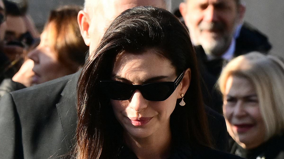 Anne Hathaway breaks down in tears at Valentino's funeral